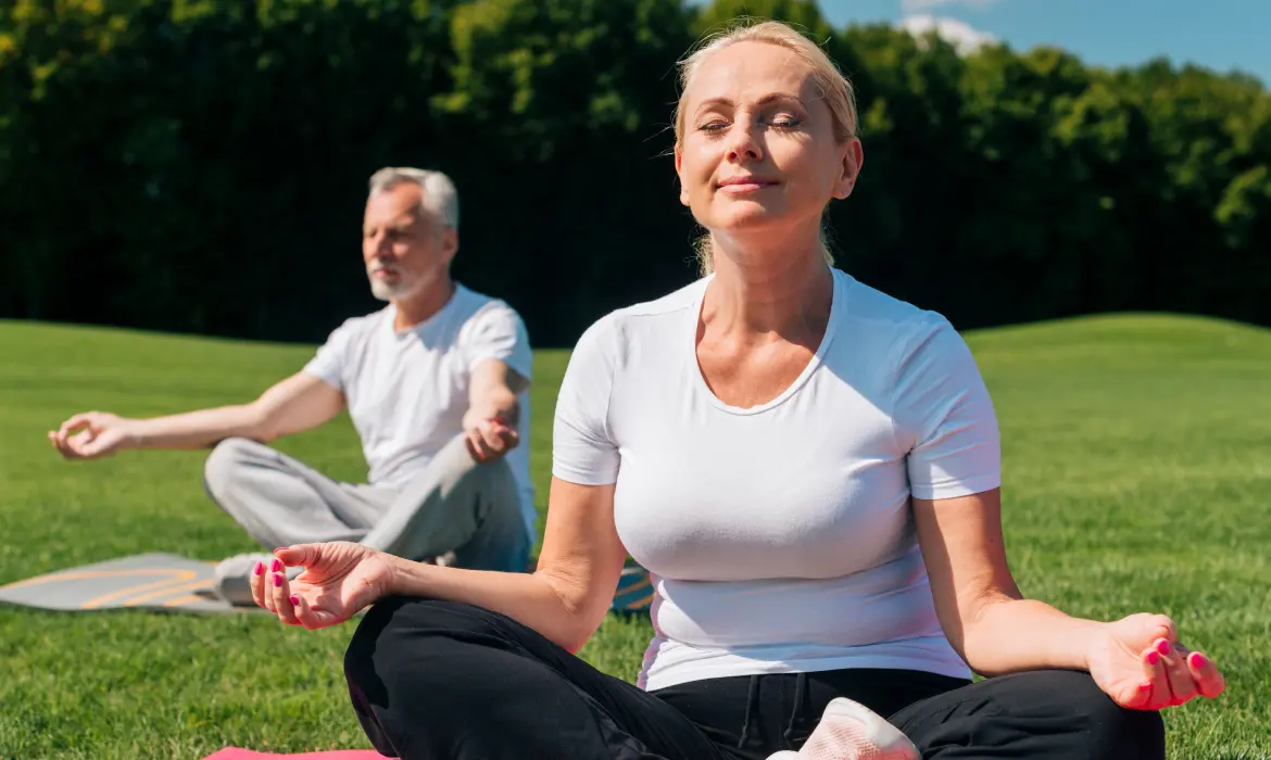 Elderly person doing yoga for mental health of peace